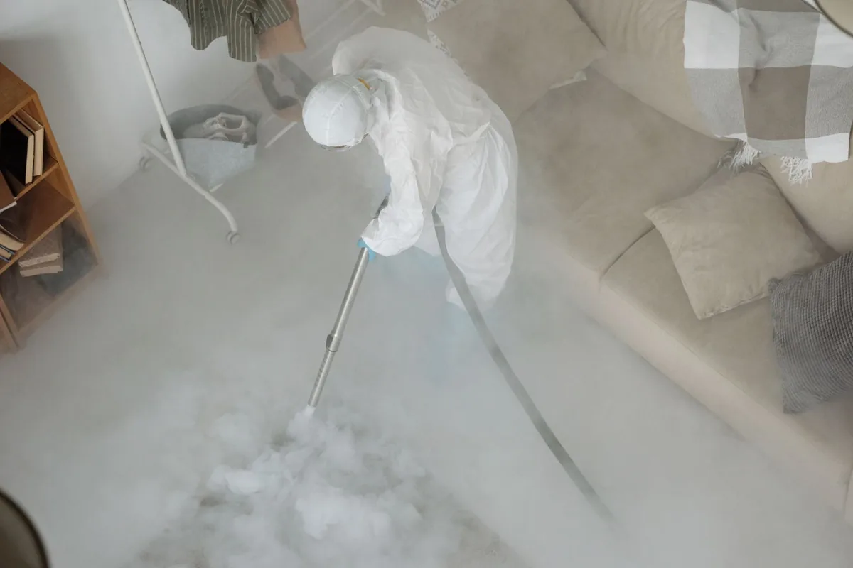 Biohazard cleanup technician in protective equipment, Middlesborough, KY